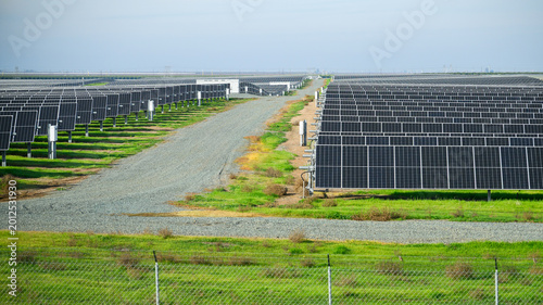 A large-scale solar power plant along the highway. California. USA.