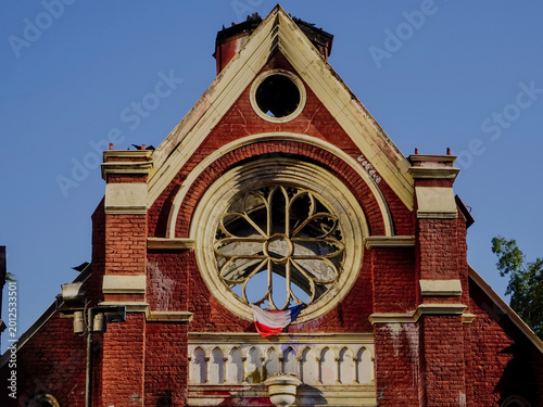 Foto Close-up view of the fire-damaged facade and broken rose window of the historic San Borja Church (former chapel of San Borja Hospital) in Santiago, Chile, a structure destroyed in 2020
