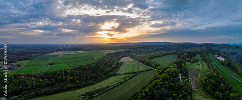 Sunset over Arundel fields and farms from a drone, Arundel, West Sussex, England