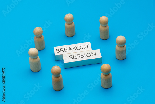 Obraz na plátně Wooden dolls arranged in a circle around white blocks with text BREAKOUT SESSION on a blue background