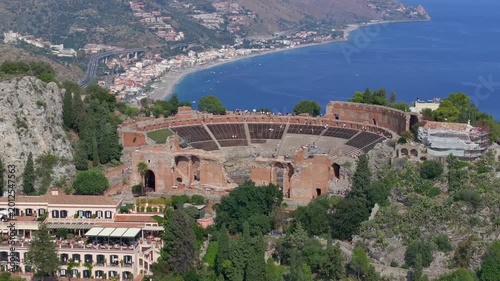 Ancient Theater in Taormina City Aerial view. Roman Amphitheater beautiful Historical Sicilian City. Sicily, Italy.