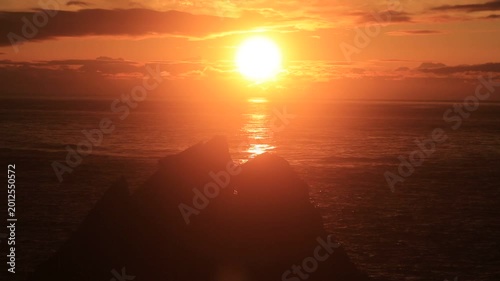 Sunset over the East China Sea with rocky coast in Amami Oshima, Japan