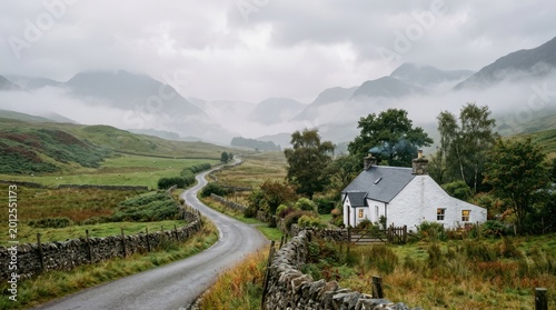 Remote Scottish cottage nestled in misty highlands with winding road and stone walls