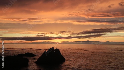 Sunset over the East China Sea with rocky coast in Amami Oshima, Japan