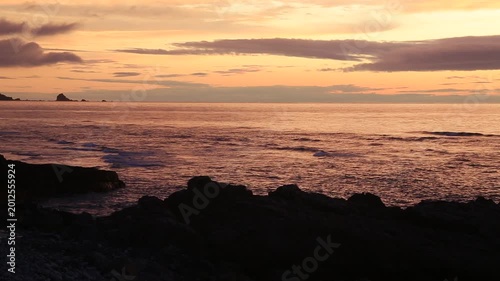 Sunset over the East China Sea with rocky coast in Amami Oshima, Japan