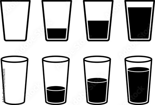 Bild auf Leinwand Glass collection showing different levels of liquid in the containers