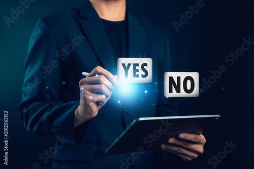 Картината върху платно Business professional using digital tablet with yes and no options for online su
