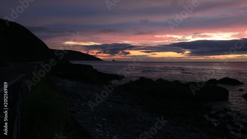 Sunset over the East China Sea with rocky coast in Amami Oshima, Japan