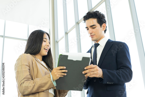 Young business people are shaking hands after a business deal. Successful negotiations or interview.