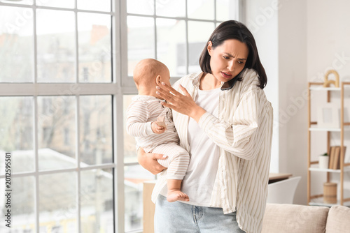 Working mother with her bab...