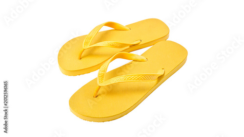 Bild auf Leinwand Pair of yellow flip-flops for summer beach vacation and relaxed poolside leisure