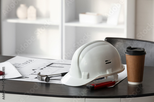 Hardhat with coffee cup and...