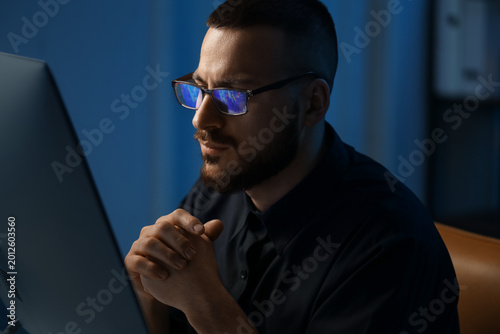 Male trader with eyeglasses...