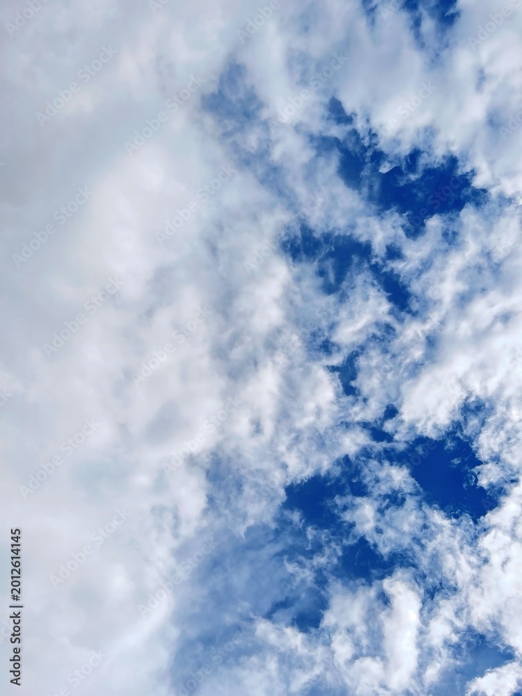 Fototapeta premium Dramatic Cloudy Sky Background With Blue Sky and Soft White Clouds