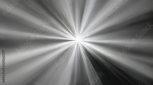 Bright, radial light burst in black and white, emanating from a central point