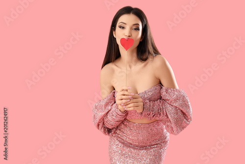 Beautiful young woman kissi...