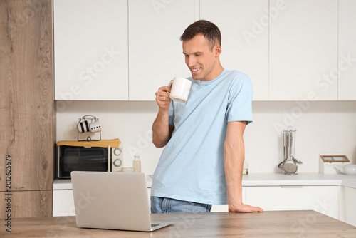 Young man with cup of hot t...