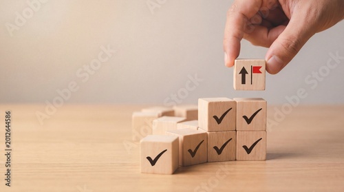 Canvastavla Hand placing final block with arrow and flag on check-marked stack, symbolizing goal achievement and progress
