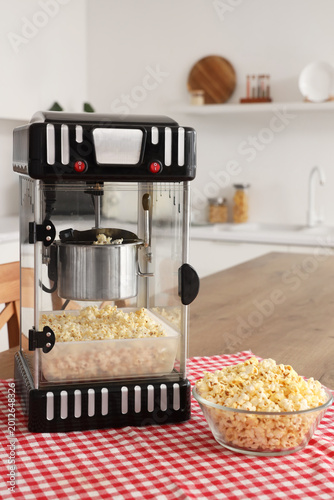 Modern popcorn machine on t...