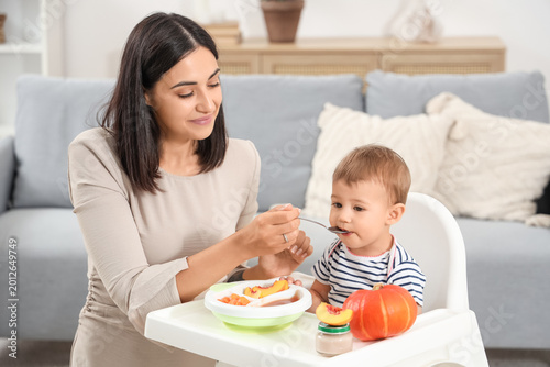 Happy mother with bowl of t...