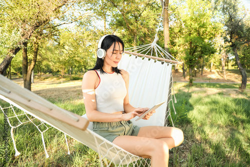 Young woman with headphones...