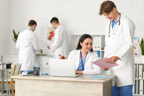 Young doctors working at ta...
