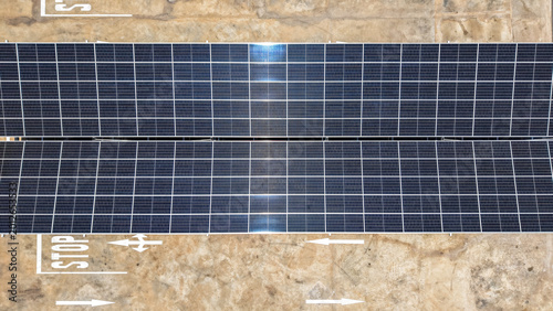 Εκτύπωση καμβά Aerial view of solar panel on a parking lot, generating sustainable power