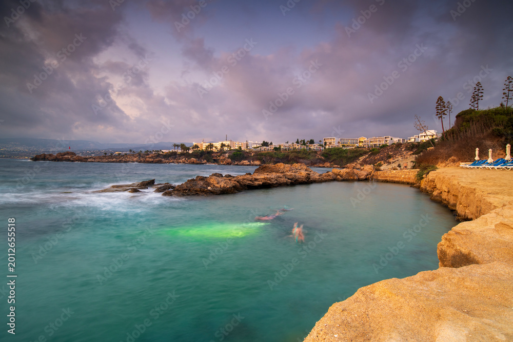 Obraz premium Sunset Over Cyprus Coastline with Golden Mediterranean Light