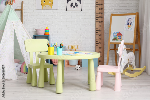 Table with chairs in interi...