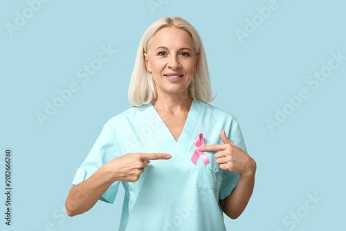 Mature female doctor with p...