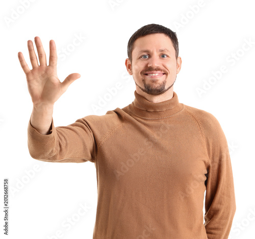 Handsome man showing five f...