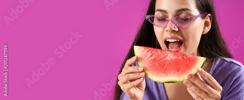Young woman eating fresh wa...