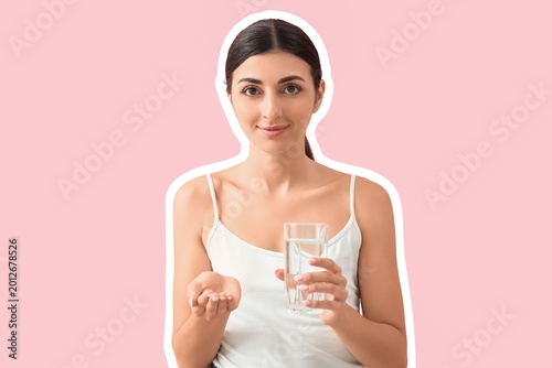 Young woman with vitamin E ...