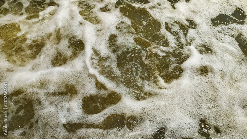 Unique patterns created by ripples in fast flowing water