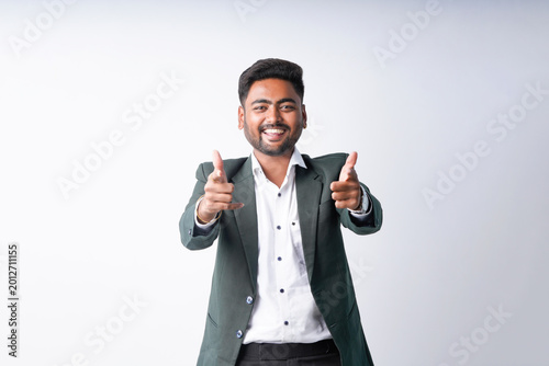 Bild auf Leinwand young indian businessman standing on white background