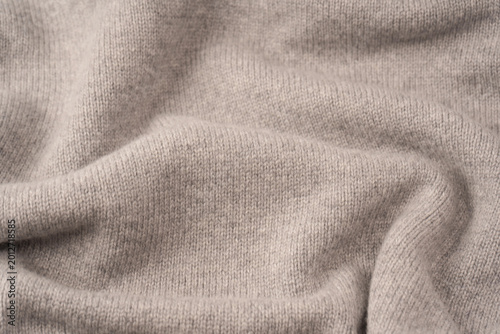 Soft grey merino wool sweater texture as a background.