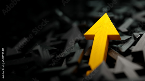 Single yellow arrow ascending from a crowd of dark arrows with stand out