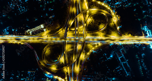 Bild auf Leinwand Dynamic yellow streaks of light illuminate nighttime expressway transport scene over busy highway, capturing urban traffic and vibrant city illumination, showcasing modern cityscape