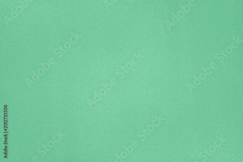 Fotografía Bright green surface with smooth texture seen in a brightly lit room during dayt
