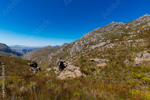 An amazing view on a perfect day over the Jonkershoek Nature Reserve located close to Stellenbosch in South Africa and home to the Jonkershoek Mountains and the impressiv valley. The reserve includes 
