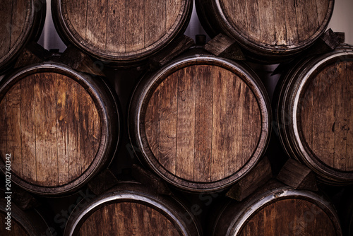 Принти на полотні Barrels stacked in a cellar at a winery during the late afternoon