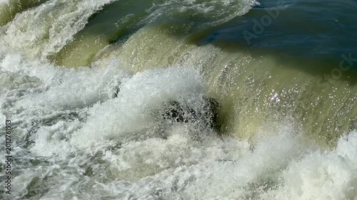 Close-up of cascading water creating white foam