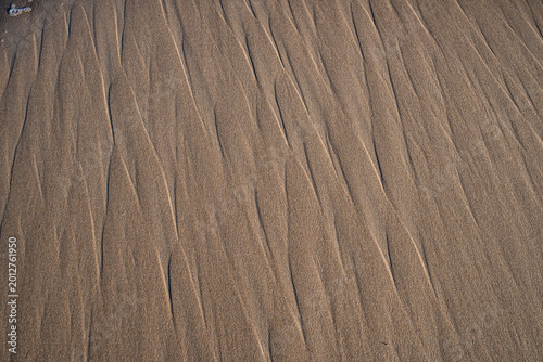 Natural Abstract Texture of Eroded Sand Patterns on a Beach