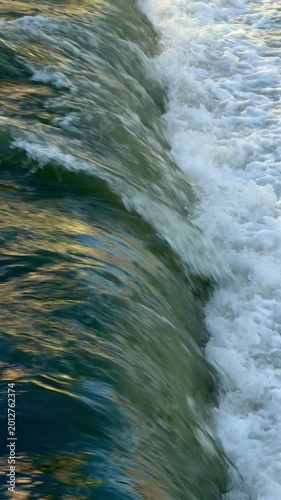 Fast-flowing mountain river creates chaotic, frothy waves