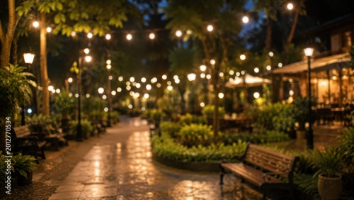 Blurred park night garden bokeh background string lights bench outdoor restaurant cafe terrace cozy evening atmosphere landscape