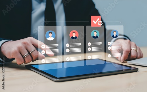 Business Person Using Digital Tablet to Evaluate Resume