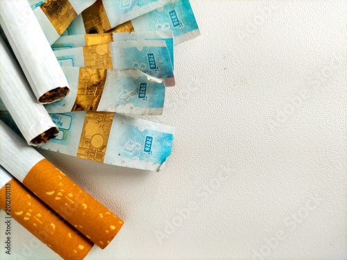 Fotografía Tobacco tax concept with cigarettes and indonesian cigarette excise stamps