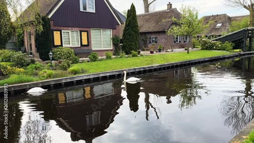 rural dutch traditional country small old town Giethoorn with canals and boats, Netherlands
