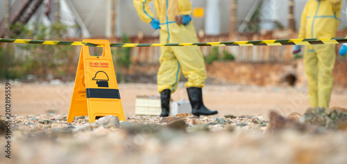 Foto Warning sign and restricted area barrier at hazardous environmental cleanup site