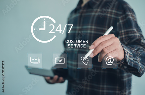 Obraz na plátně User accessing 24-7 customer service on tablet, digital communication icons for chat, email, phone and support, omnichannel assistance, responsive helpdesk and customer support concept